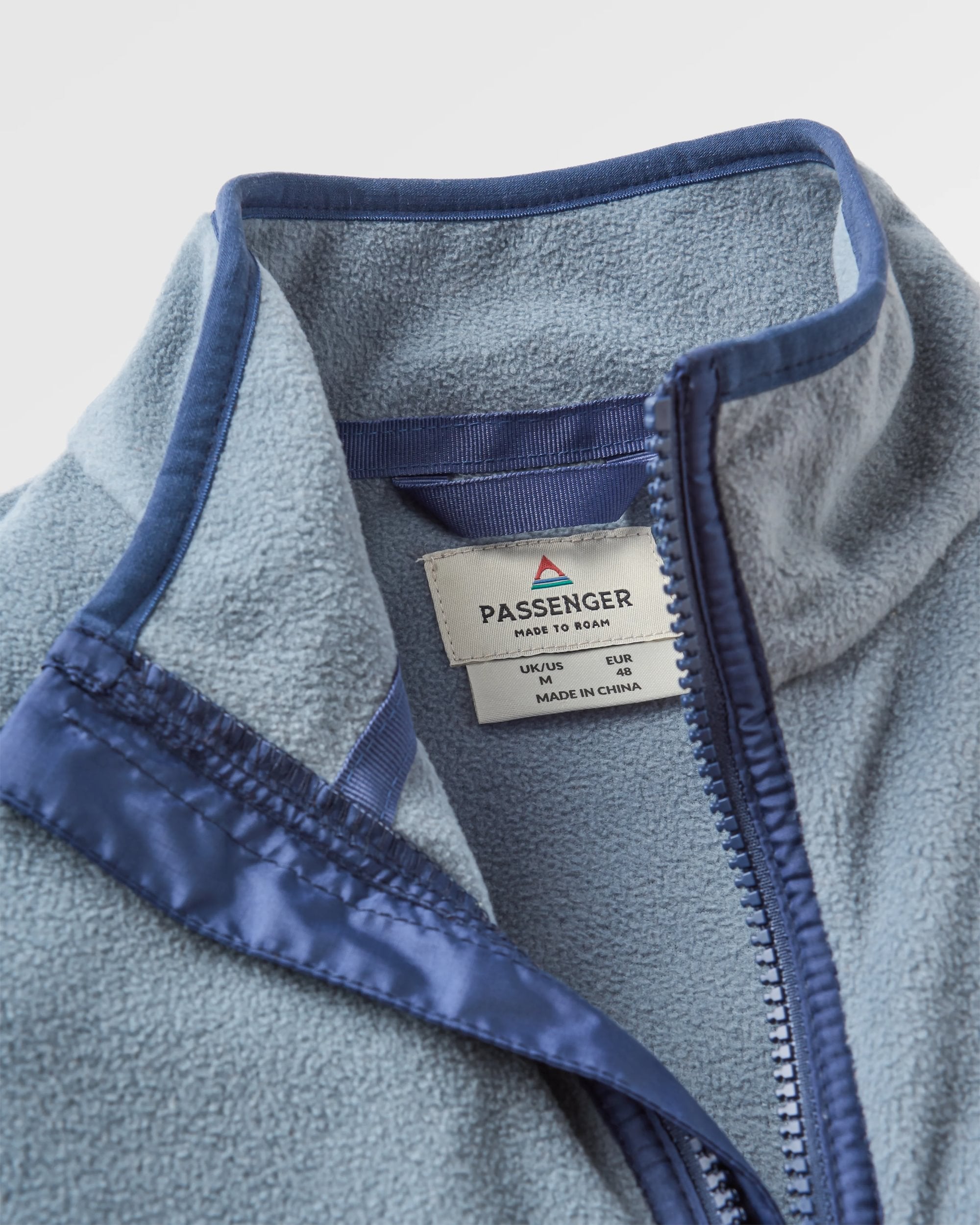 Set Off Recycled Polar Fleece - Sunset Orange/Storm Grey - Flatlay