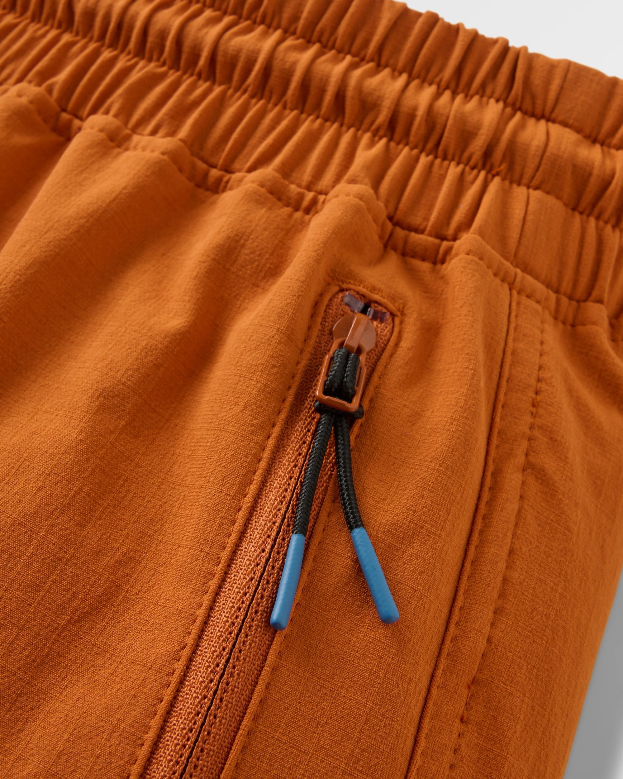 Sandstone Recycled Active Trail Jogger - Sunset Orange - Flatlay